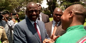 Deputy President William Ruto shakes hands with Nominated MP David Ole Sankok at an event in Kisii County on October 6, 2016