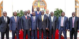 President William Ruto (centre) and his deputy Rigathi Gachagua (third from right) pose with nine ODM Mps at State House, Nairobi on Tuesday, February 7, 2023.