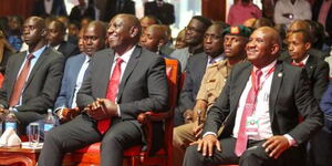 President William Ruto and KRA General Commissioner Githu Mburu following proceedings during Taxpayers Day on October 28, 2022.