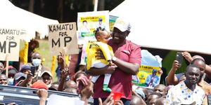 Ruto Carrying Child