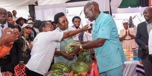 President William Ruto interacting with traders during the Hustler Fund anniversary in Nairobi on November 29, 2023.