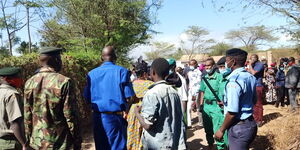 Police dispersing a crowd from the burial of former Mahoo MCA, Ronald Sagurani on August 24, 2021.