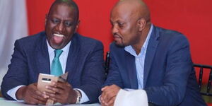 Deputy President William Ruto (left) with Gatundu South MP Moses Kuria at a private wedding at Greens Golf Resort, Thika on Friday, November 29, 2019.