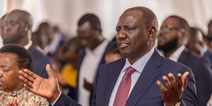 President William Ruto (right) and First Lady Rachel Ruto lift their hands during a prayer session at a past church service. 