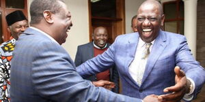 President William Ruto embracing Prime CS Musalia Mudavadi as Nandi Senator Samson Cherargei and former Captain Kungu Muigai watches on in a past event