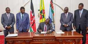 President William Ruto signs the Division of Revenue Bill in State House on April 27, 2023. With him are (from left): National Assembly Majority Leader, Kimani Ichung'wah, National Assembly Speaker, Moses Wetangula, Deputy President Rigathi Gachagua, and Attorney General, Justin Muturi.