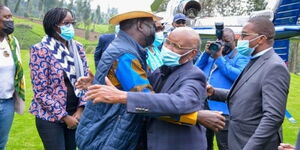 Royal Media Founder SK Macharia hugging Former Prime Minister Raila Odinga in Muranga County on July 27.