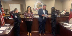 Saladi Mohamed, right, take the oath of office, administered by Landis Mayor Meredith Smith and Landis Mayor Pro Tem Ashley Stewart.