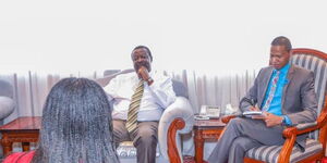 Prime Cabinet Secretary Musalia Mudavadi (left) and his Communications Director, Salim Swaleh  during a past meeting on January 26, 2023.