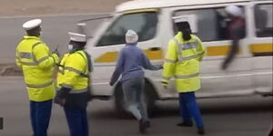 Screenshot of three Police officers and a civilian allegedly taking bribes from a matatu.