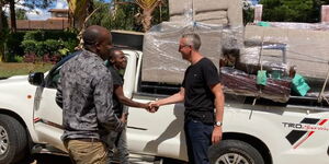 Sebastian Groth, German Ambassador to Kenya (right) greets Unique B Furniture owner Bernard Wambua Chule after purchasing a Ksh75,000 sofa set along Ngong Road on January 10, 2023. 