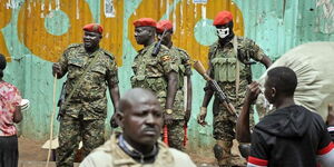 Security officials monitor events in Kampala
