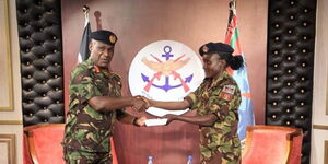 Sergeant (Sgt) Joyciline Jepkosgei (right) and Chief of Defence Forces (CDF) General Robert Kibochi (left) on Tuesday, October 4, 2022