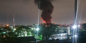 Several buildings surrounding the burning go-down on Monday night South B