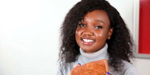 Sheryl Mboya the 22-year old Mount Kenya University Law student with her edible plate