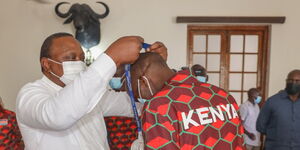 Silver Medalist Receives a Medal From President Uhuru Kenyatta at State House on Monday, August 16.