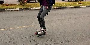 A road user skating in Nairobi.