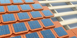 File photo of Solar roofing tiles being erected on a house