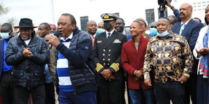 President Uhuru Kenyatta speaking while accompanied by Mike Sonko, Embakasi East MP Babu Owino and Nairobi Governor Anne Kananu