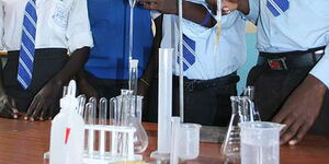 Students carrying out a science experiment in a science laboratory