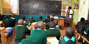 A teacher and students inside a classroom at Kawangware Primary School, Nairobi, on October 5, 2015.