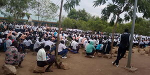 Students study under trees in Kakuma