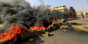 Demonstrators take to the streets of Khartoum to protest against the arrests on Monday, October 25.