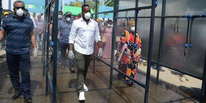 Suleiman Shabhal and Hassan Joho inspecting the newly installed public spray booth at the Likoni Crossing Channel in Mombasa.