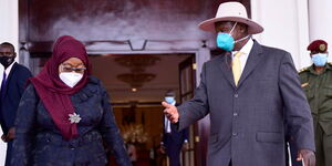 President Yoweri Museveni welcomes President Samia Suluhu to Uganda on March 11, 2021