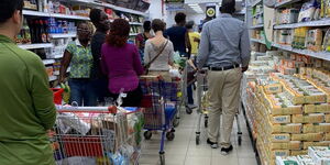 A photo of people queuing to pay at a Nairobi supermarket on Friday, March 13, 2020.