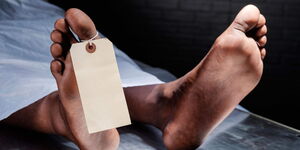 An undated image of a tag hanging on a corpse's leg in a morgue