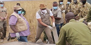 Tourism CS Najib Balala (third left) takes part in Elephant Collaring Exercise at Amboseli National Park