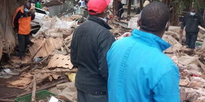 Traders Trying To Salvage Goods from a Rubble at the Fig Tree Market in Ngara, Nairobi on July 27.