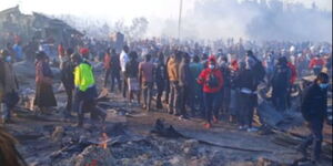 Traders look at ruins left after fire razed down stalls at Gikomba Market on Monday, November 8, 2021.
