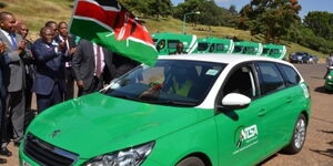 Transport CS James Macharia flags off an NTSA branded car