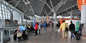 Travellers at the Frederic Chopin Airport in Poland.