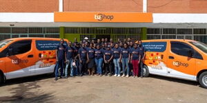 An image of Tushop staff members outside their offices.