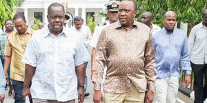 Former President Uhuru Kenyatta (right) with former Interior CS Fred Matiang'i at Coast in January 2019.