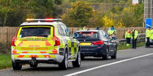 UK traffic police conducting inspections on a highway 