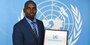 UN Kenyan Person of the Year Aaron Nanok poses with his award at the UNEP headquarters in Gigiri, Nairobi on Monday, October 24, 2022
