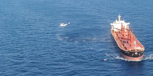US Air Force helicopter and US cargo ship Liberty Grace in the Indian Ocean.