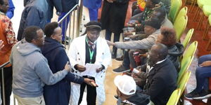 Uasin Gishu Woman Representative Gladys Shollei (centre) holds a piece of paper at the Bomas of Kenya on August 12, 2022.