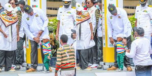 President Uhuru Kenyatta and his grandson at the launch of the World Rally Championship (WRC) Safari Rally on Thursday, June 23, 2022.