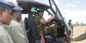 President Uhuru Kenyatta inspects one of the military armoured choppers during Kenya Defence Forces Day celebration in Gilgil in 2018