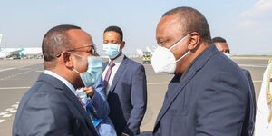 President Uhuru Kenyatta is received by Ethiopia Prime Minister at Bole International Airport on Tuesday, June 8 