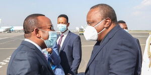 President Uhuru Kenyatta is received by Ethiopia Prime Minister at Bole International Airport on Tuesday, June 8