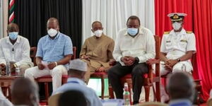 President Uhuru Kenyatta (right) with Health CS Mutahi Kagwe (left) during the biometric registration of the Universal Healthcare Coverage Programme (UHC) in Mombasa County on Saturday, October 30, 2020