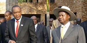 President Uhuru Kenyatta (left) and President Yoweri Museveni during a past summit in Uganda. 