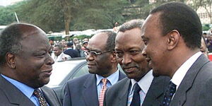Former President Mwai Kibaki (left) with President Uhuru Kenyatta (right) in an event in 2010