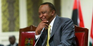 An image of President Uhuru Kenyatta laughing at a past function.